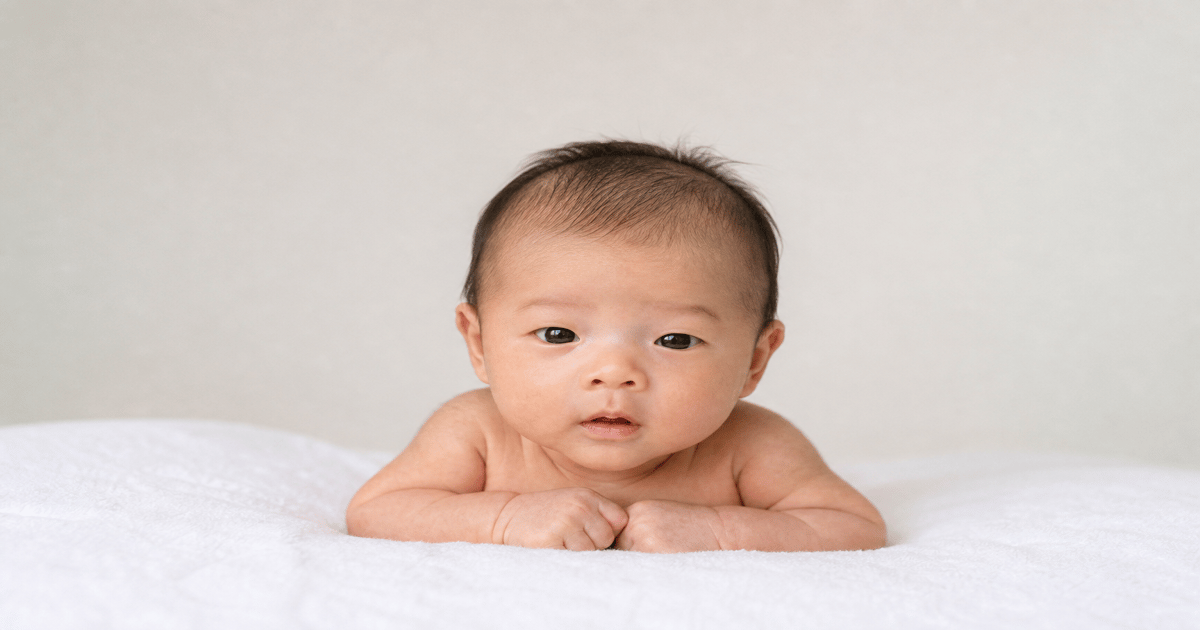 Newborn passport photo setup with plain white background for DS-11 applications